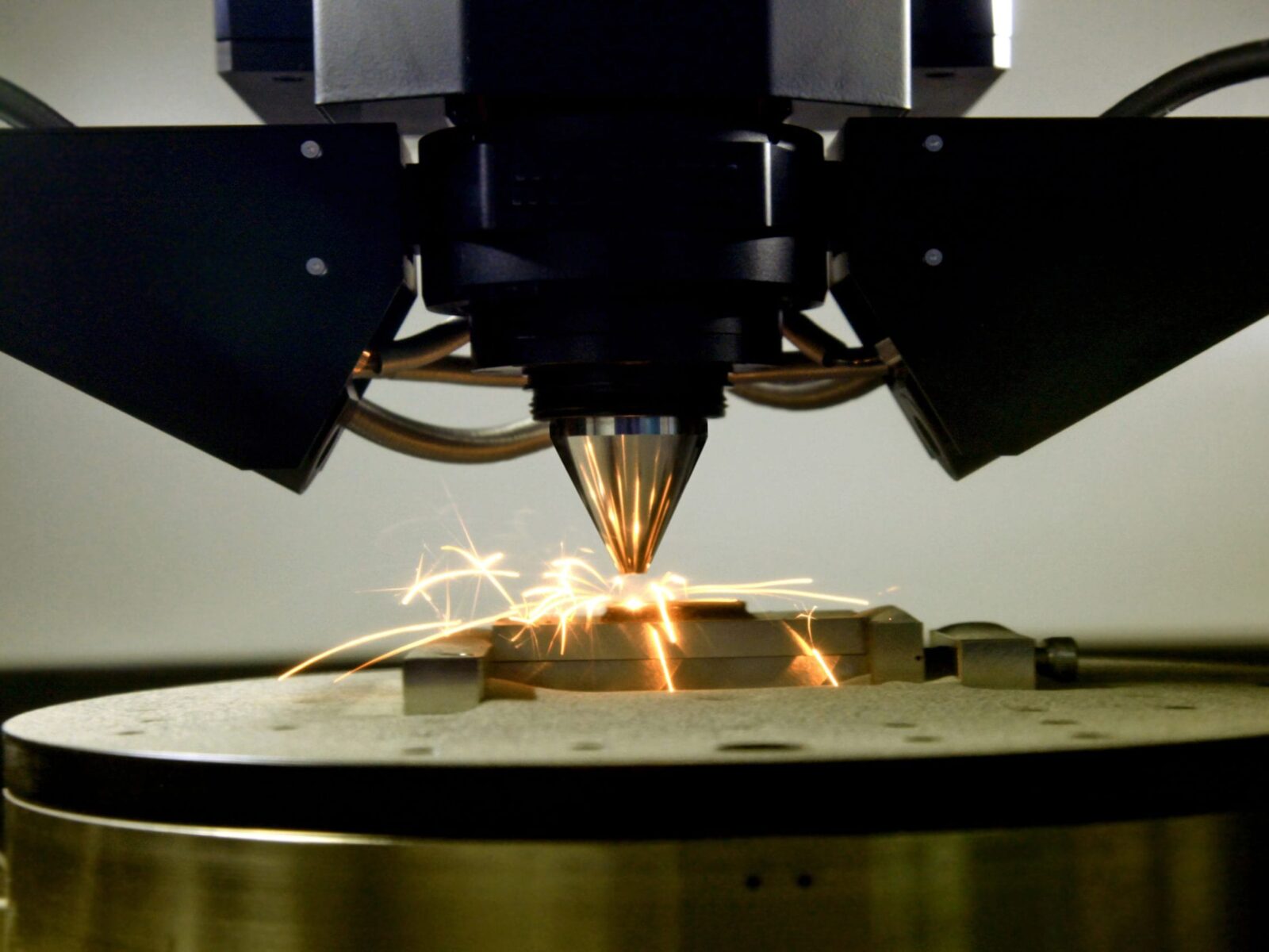 detail of 3d printer printing a metal piece