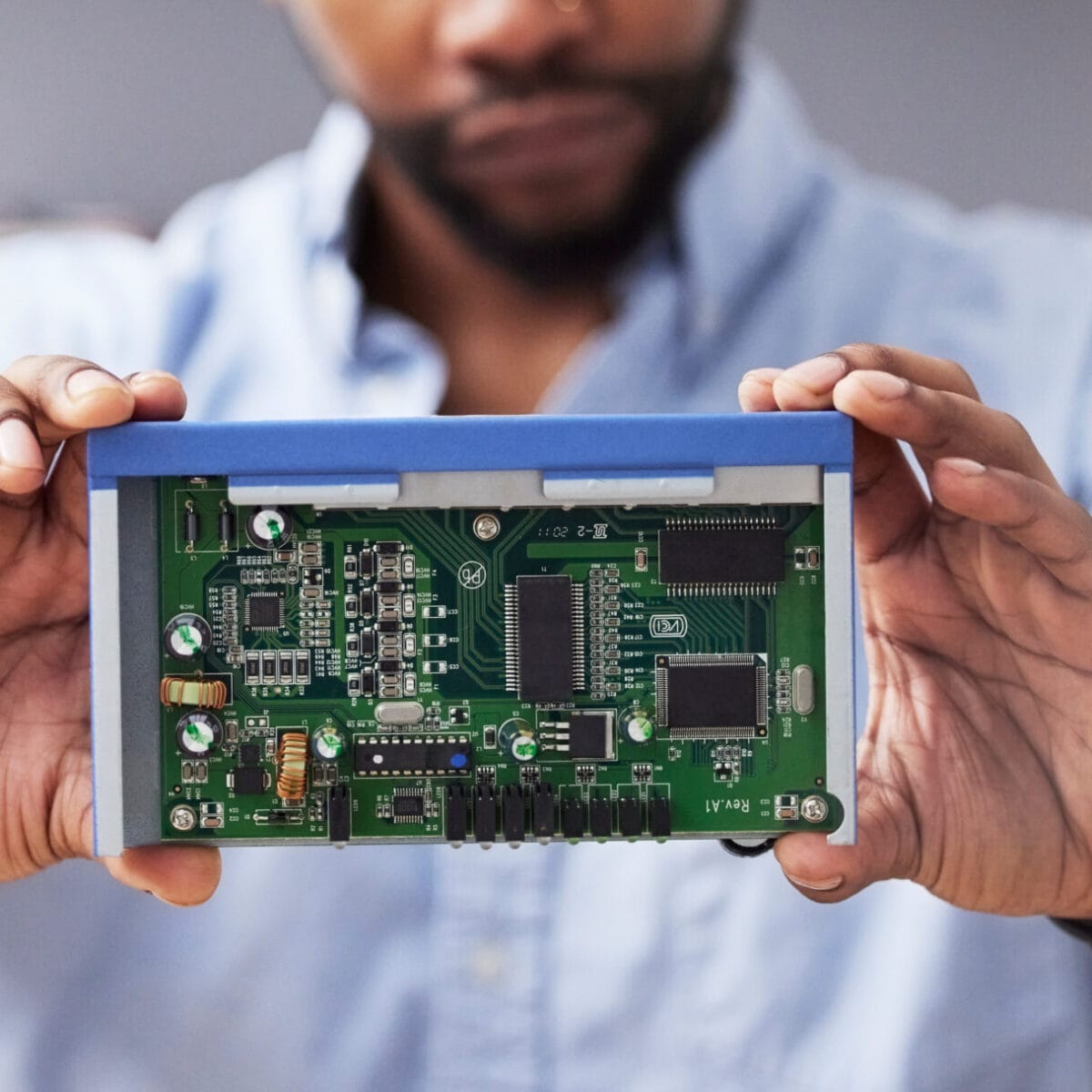 Circuit board, hands and technician with computer hardware, man in office with maintenance and elec.