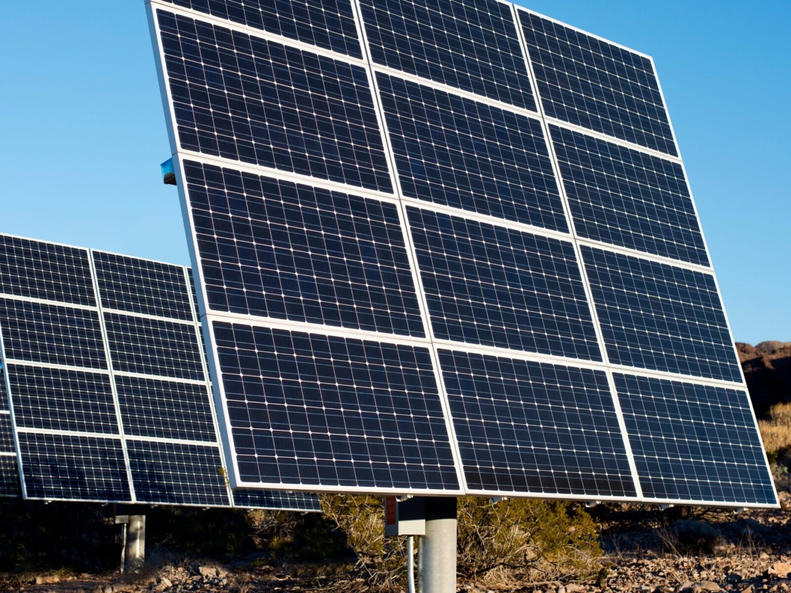 A close up picture of solar arrays in the desert with a slanting angle.